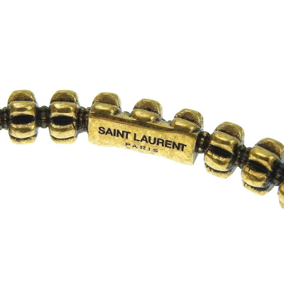 Yves Saint Laurent Armreif/Armband aus Vergoldet in Gold