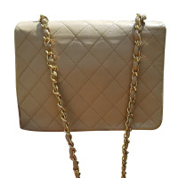 Chanel Classic Flap Bag New Mini en Cuir en Beige