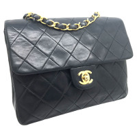 Chanel Classic Flap Bag New Mini aus Leder in Schwarz
