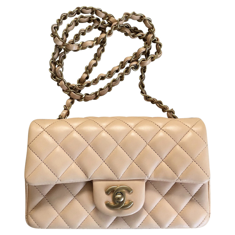 Chanel Classic Flap Bag New Mini Leer in Beige