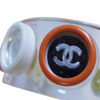 Chanel Armreif aus Acrylglas mit Spielknöpfen