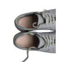 Axel Arigato Sneakers aus Leder in Grau