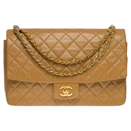 Chanel Flap Bag aus Leder in Gold
