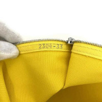 Hermès Clutch aus Canvas in Gelb