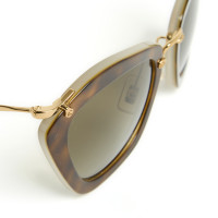 Miu Miu Sunglasses in Gold
