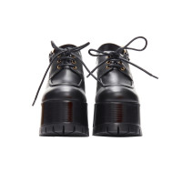Versace Sandalen aus Leder in Schwarz