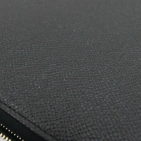 Hermès Täschchen/Portemonnaie aus Leder in Schwarz