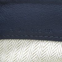 Hermès Clutch aus Canvas in Ocker