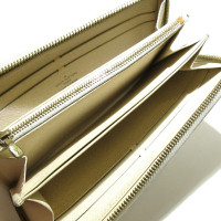 Louis Vuitton Täschchen/Portemonnaie aus Canvas in Gold