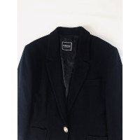 Versace Jacke/Mantel aus Wolle in Schwarz