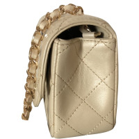 Chanel Classic Flap Bag Extra Mini Leer in Beige
