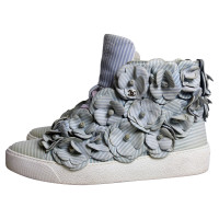 Chanel High top sneakers with camellias