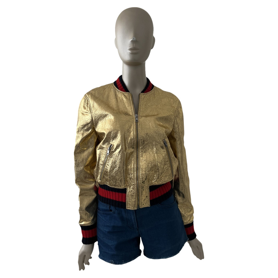 Gucci Jacke/Mantel aus Leder in Gold
