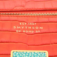Smythson clutch in het rood