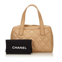 Chanel Surpique Leer in Beige