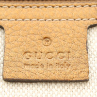 Gucci clutch in pelle color oro