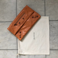 Balenciaga clutch in orange-brown