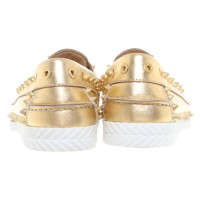 Christian Louboutin Golden slipper with rivets