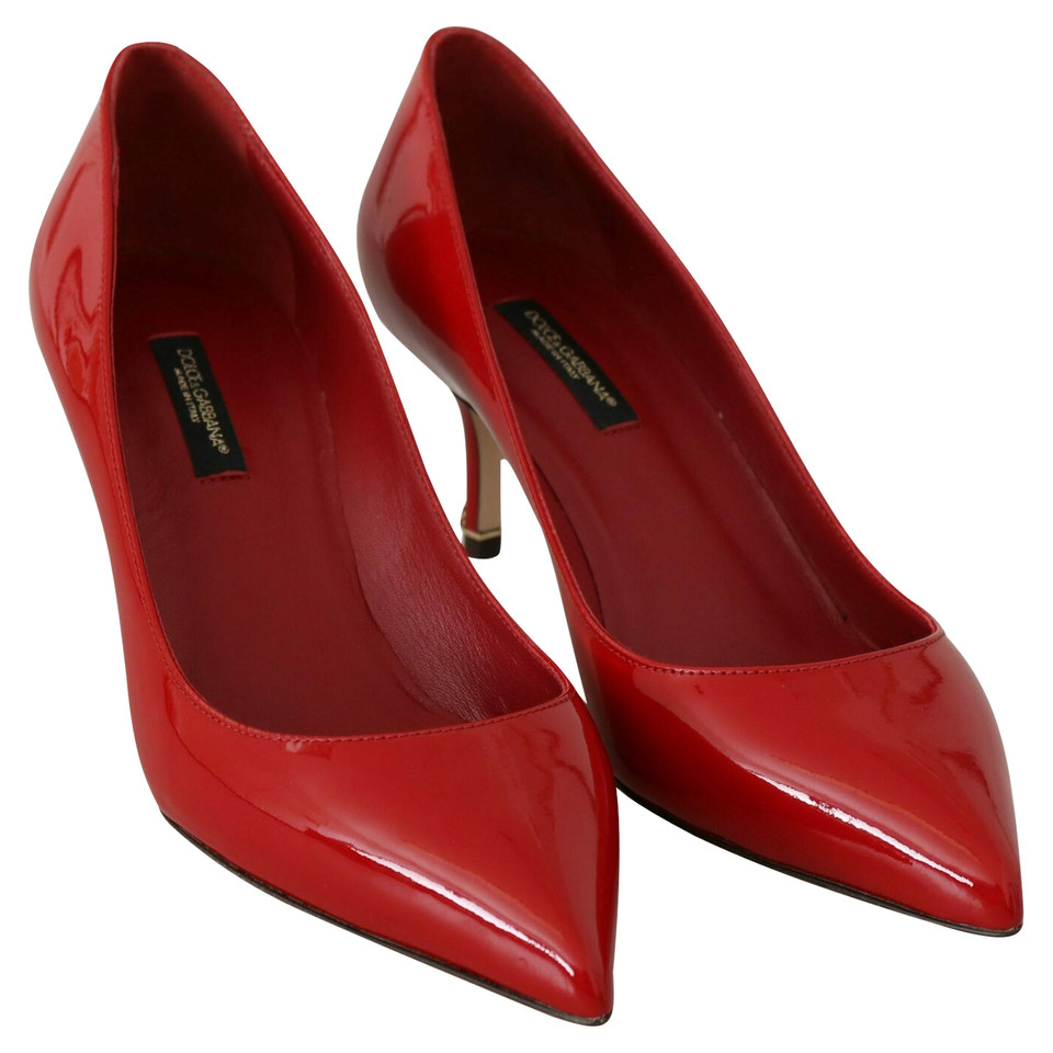 Dolce & Gabbana Pumps/Peeptoes aus Leder in Rot