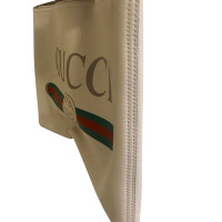 Gucci clutch con logo stampato