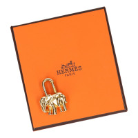 Hermès Gold colored bag charm
