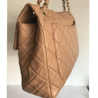 Chanel Classic Flap Bag Maxi Leer in Beige