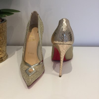 Christian Louboutin Gold colored pumps