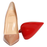 Christian Louboutin Patent Leather pumps in Nude