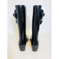 Chanel Rubber boots with camellias
