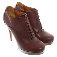 Gucci Stiefeletten aus Leder in Bordeaux