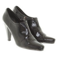 Prada Laced leather ankle boots in black