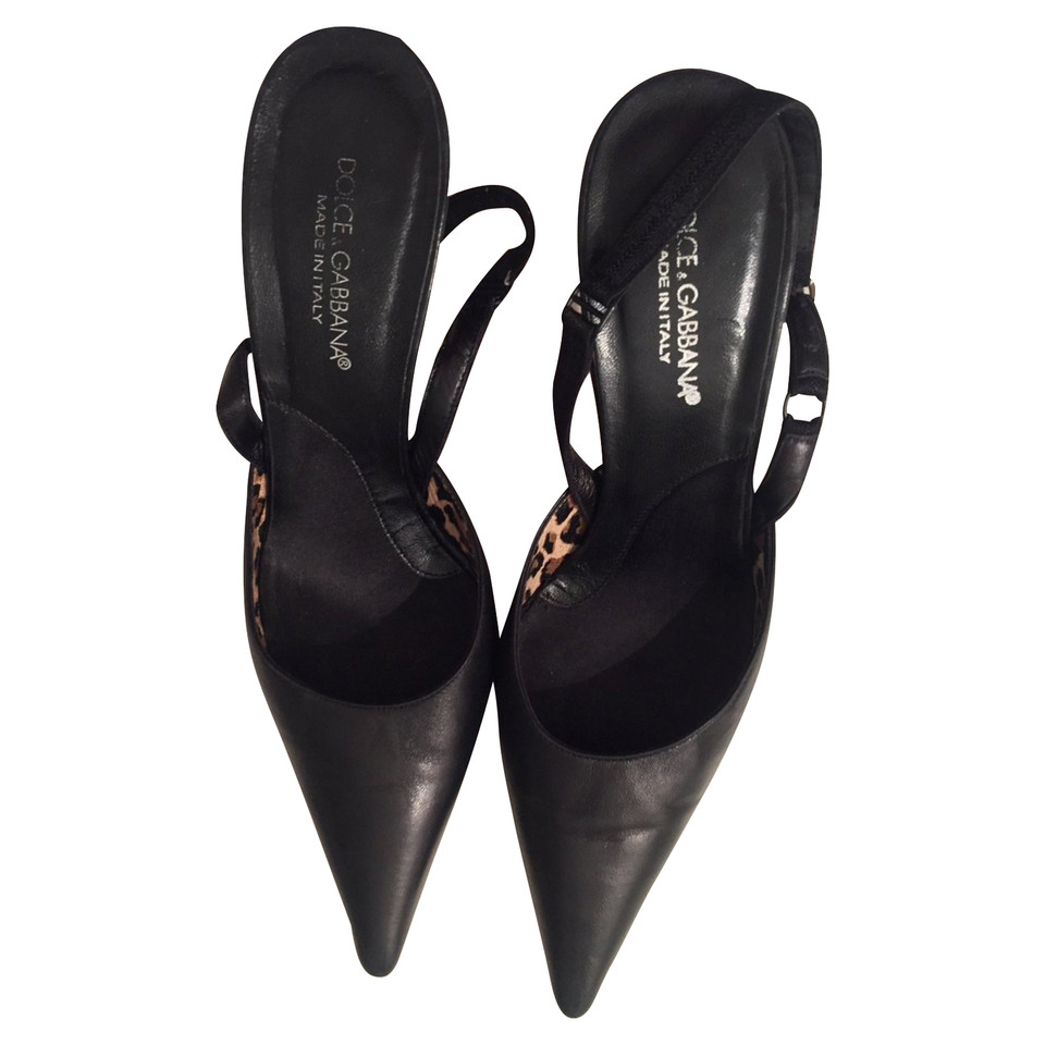 Dolce & Gabbana Pumps/Peeptoes aus Leder in Schwarz