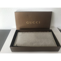 Gucci Täschchen/Portemonnaie aus Leder in Gold
