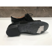 Clarks Chaussures à lacets en Cuir verni en Noir