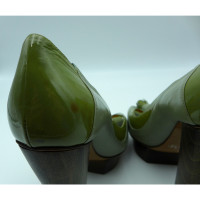 Pollini Pumps/Peeptoes aus Leder in Grün