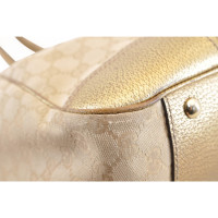 Gucci Sherry Line GG Umhängetasche aus Canvas in Gold