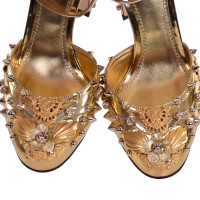 Dolce & Gabbana Pumps/Peeptoes aus Lackleder in Gold