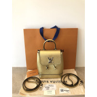 Louis Vuitton Rucksack aus Leder in Gold