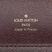 Louis Vuitton Clutch Leer in Bruin