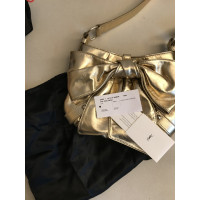Yves Saint Laurent Shoulder bag Leather in Gold