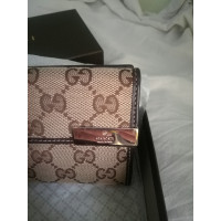 Gucci Täschchen/Portemonnaie aus Canvas in Braun