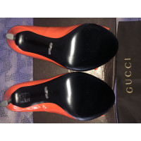 Gucci Pumps/Peeptoes Patent leather in Orange