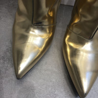Balenciaga Stiefeletten aus Leder in Gold