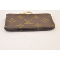 Louis Vuitton Täschchen/Portemonnaie aus Canvas in Braun