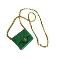 Chanel Necklace with emerald green mini flap bag