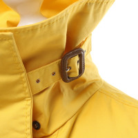 Burberry Jacke/Mantel aus Baumwolle in Gelb