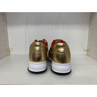 Hogan Sneakers aus Leder in Gold