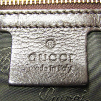 Gucci Clutch aus Leder in Braun
