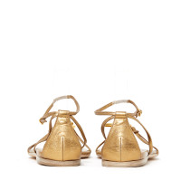 Hermès Sandalen aus Leder in Gold