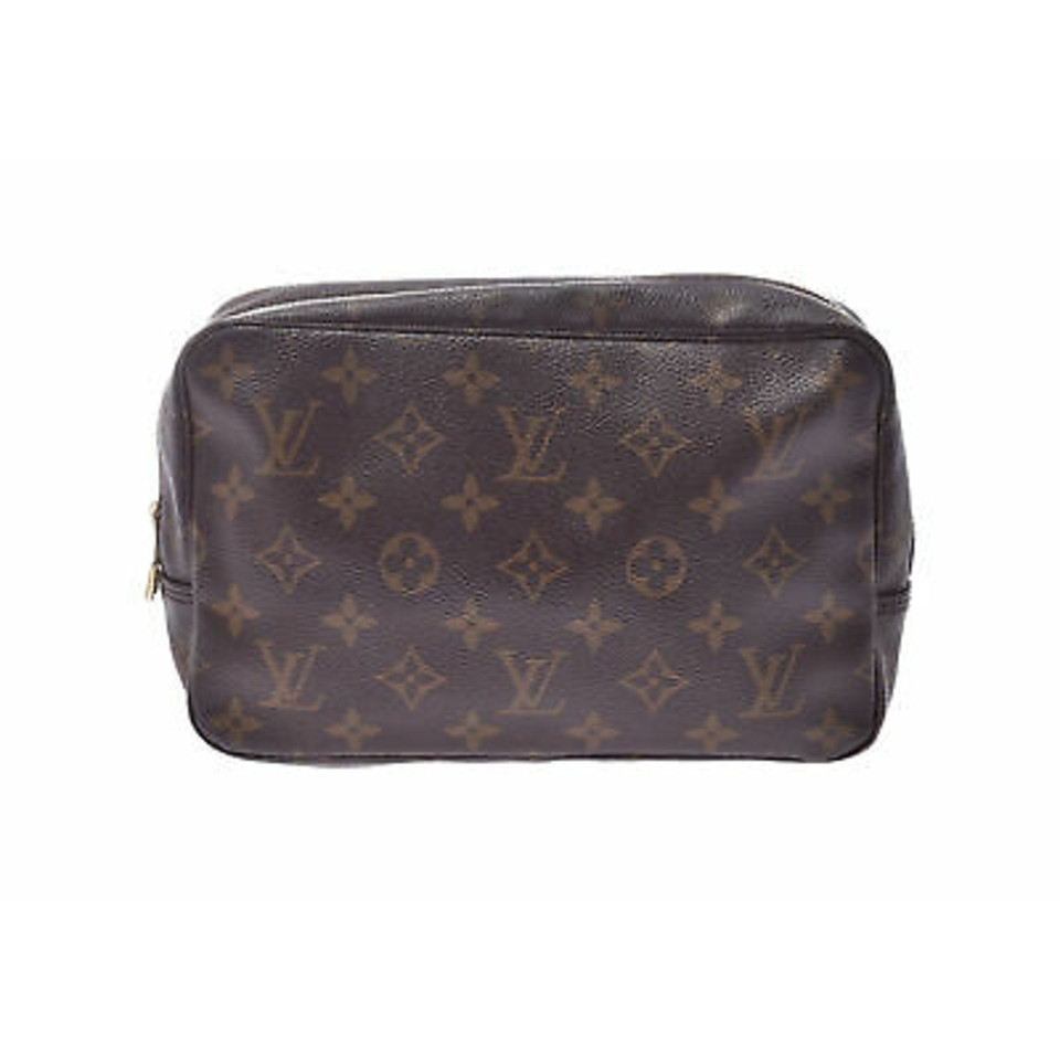 Louis Vuitton Clutch aus Canvas in Braun